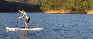 paddle boarder at sunny day adventures
