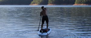 stand up paddle boarding at sunny day adventures